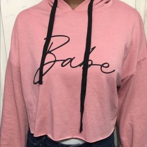 A pink & black croptop hoodie